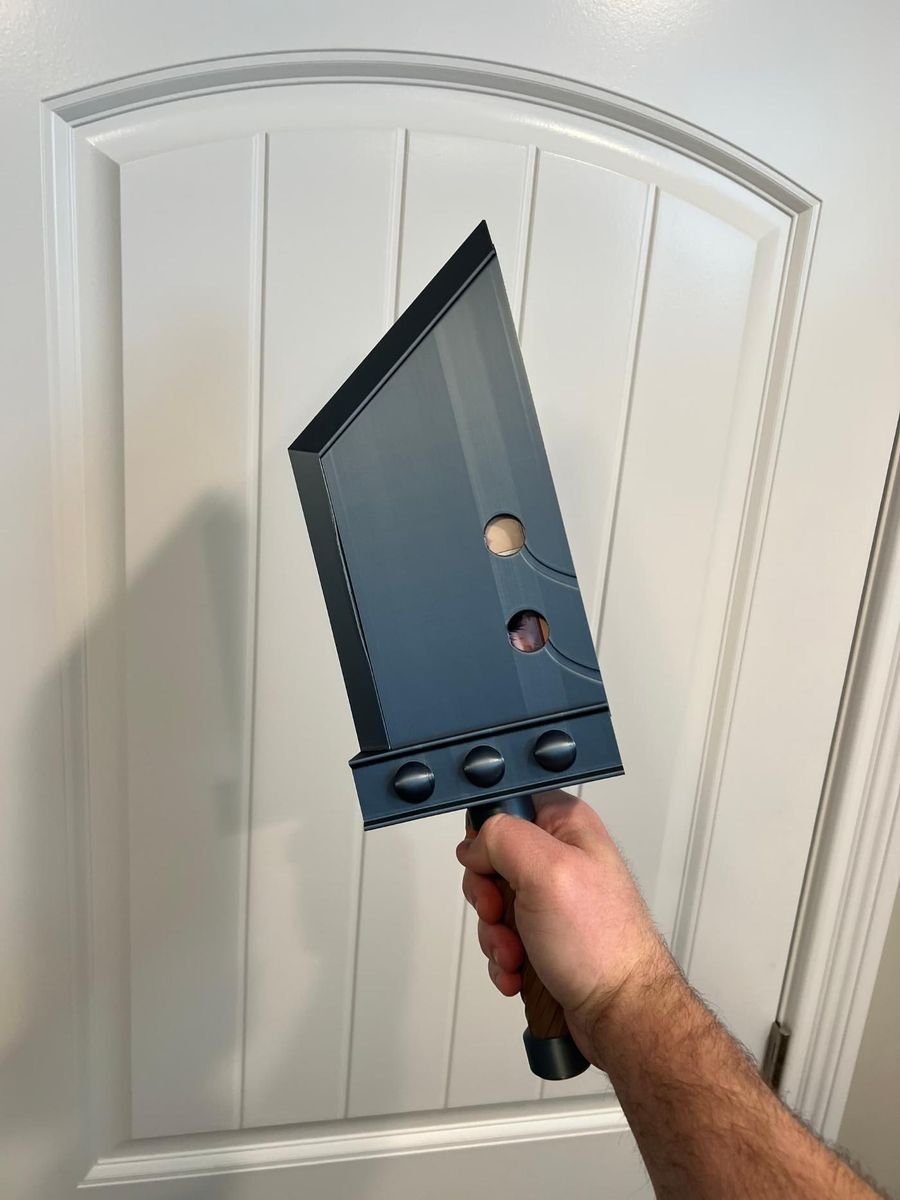 Buster Sword deck box held up in a doorway